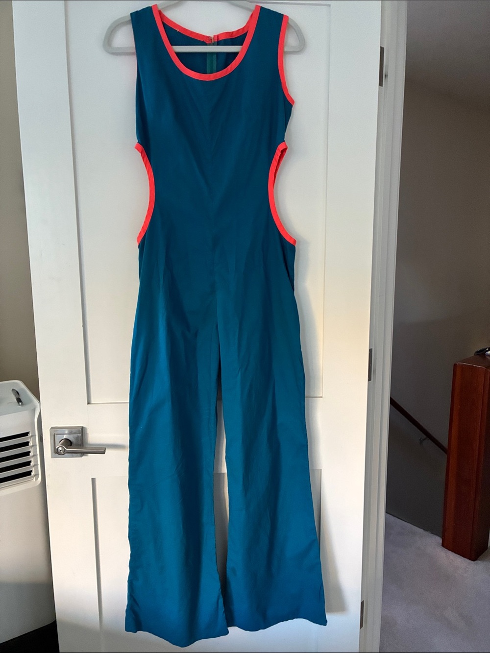 Woman’s Teal One-Piece Jumpsuit with Coral Trim
